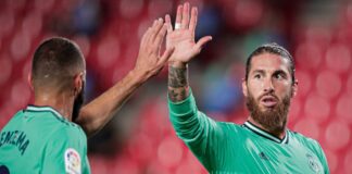 Real Madrid are on the Verge of Winning La Liga Ramos wearing Real Madrid's shirt high-fiving Benzema