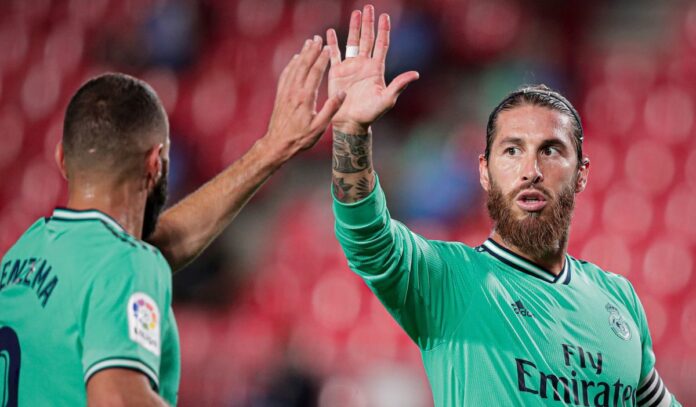 Real Madrid are on the Verge of Winning La Liga Ramos wearing Real Madrid's shirt high-fiving Benzema