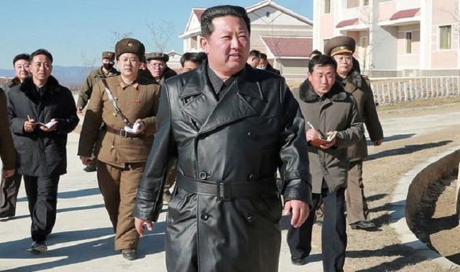 Kim Jung Un wearing the controversial leather coat