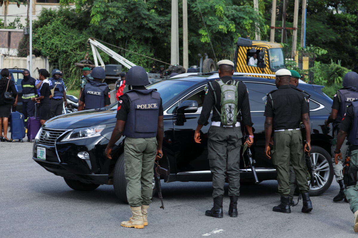Police officers are seen conducting checks on vehicles at the Federal High court in Abuja The police