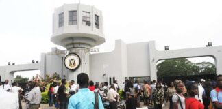 Even though the grass is not greener on the other side, UI students insist they must leave the country UI students in front of the school's gate