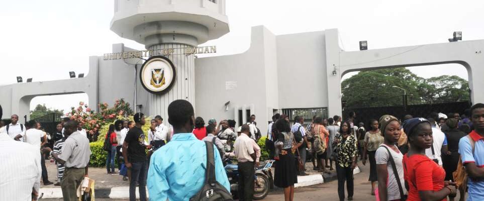 UI students in front of the school's gate