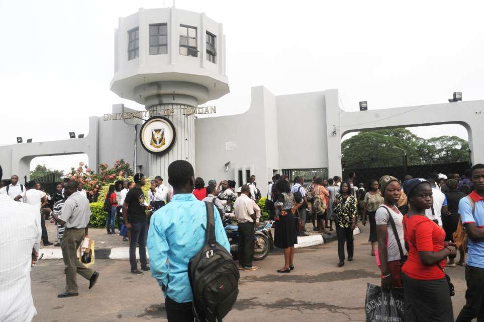 UI students in front of the school's gate