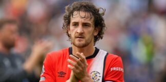 Tom Lockyer: Luton captain in “period of rehabilitation” after being discharged from hospital