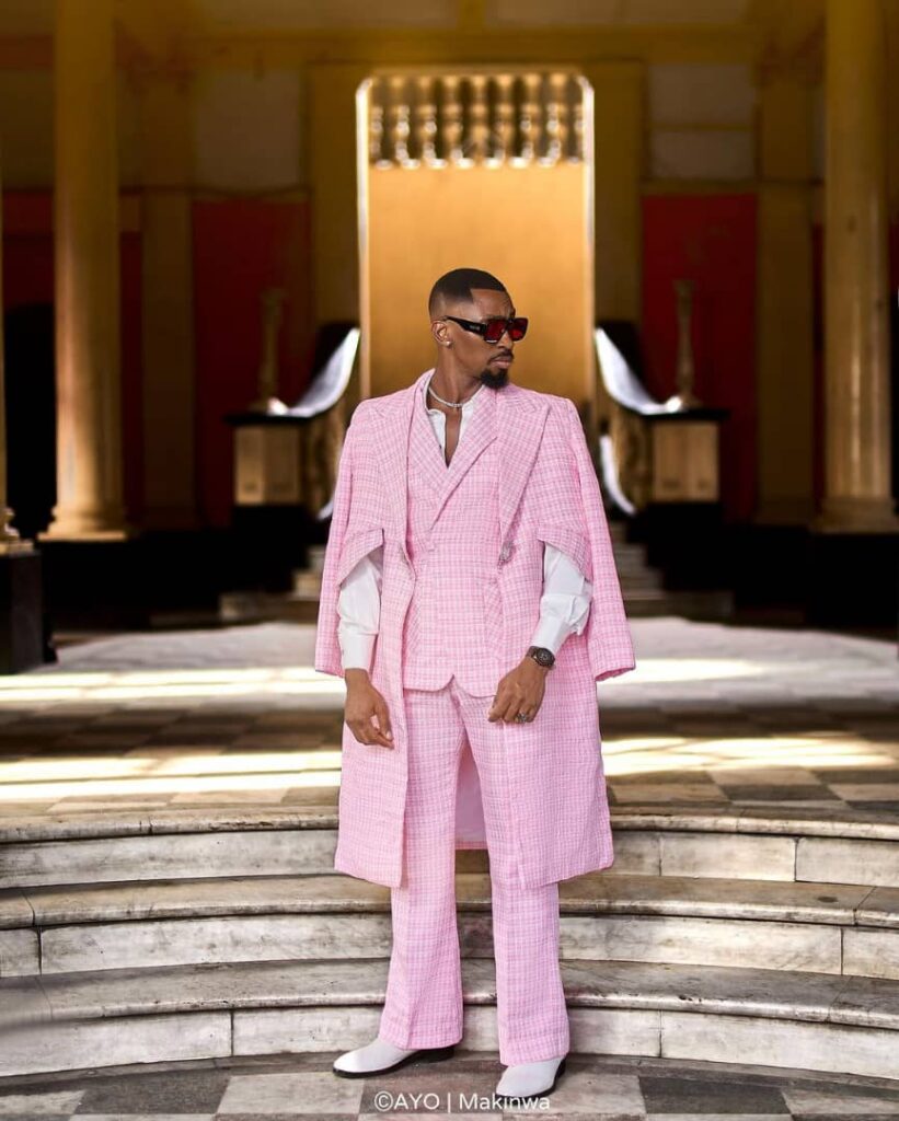 Saga Adeolu in a double armed pink suit