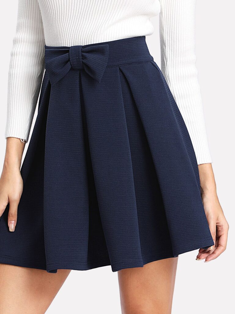 SHEIN Bow Front Box Pleated Textured Skirt.
 Photo Credit:- SHEIN/Pinterest 