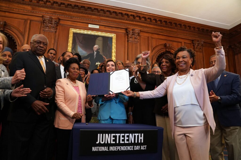 Speaker of the House Nancy Pelosi and members of the Congressional Black Caucus at a bill ceremony for the Juneteenth National Independence Day Act at the Capitol. 
Photo Credit:- Stefani Reynolds |The New York Times