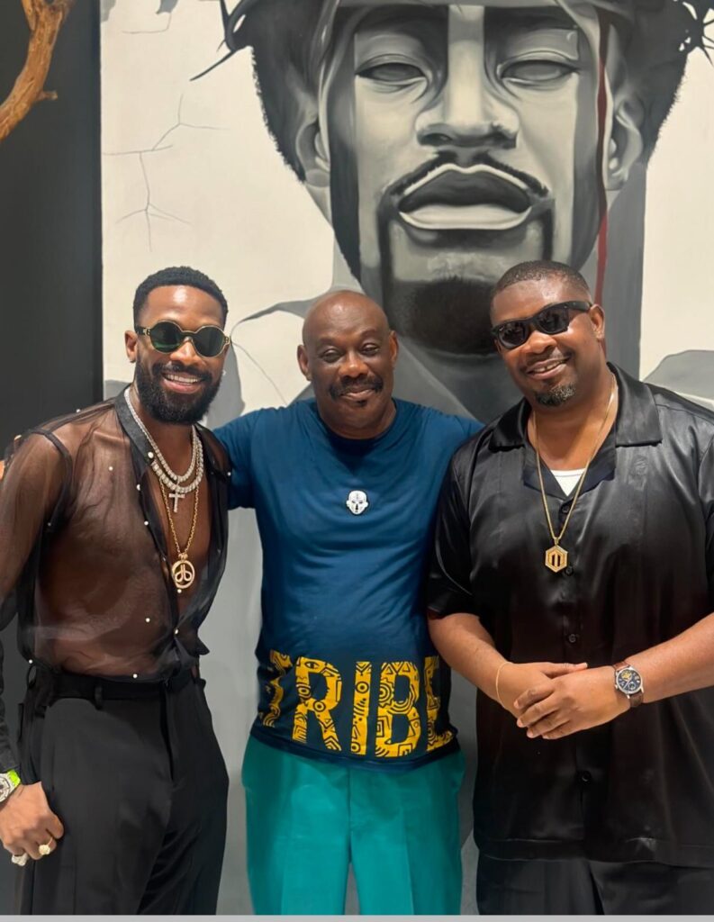 D'Banj alongside Don Jazzy and his father, Ajereh Collins