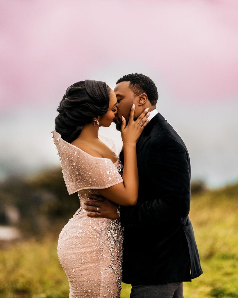 Sharon Ooja kisses her partner, Ugo share a kiss (Photo Credit: Bella Naija)