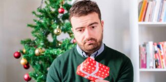 5 best ways to react when you don’t like your partner’s gift A man staring at a gift from his partner. Credit: iStock