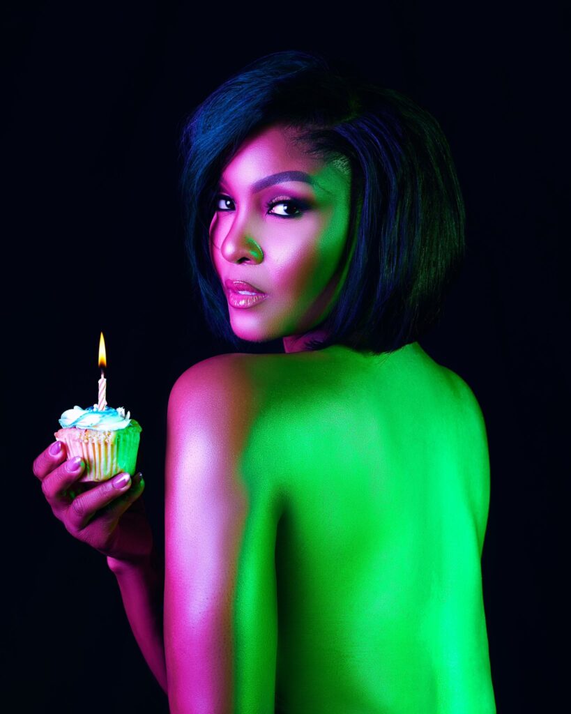 Ighodaro seen holding a cake