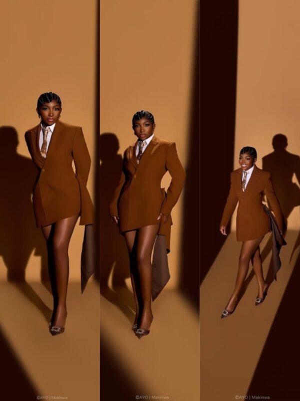 Omowunmi Dada in a brown suit gown