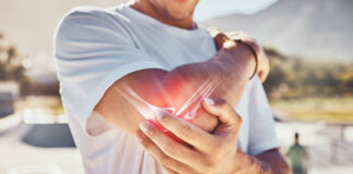 From diet to exercise: Home treatments to relieve arthritis pain, stiffness Man, joint pain and elbow arthritis in outdoor closeup in summer sunshine with massage arms.