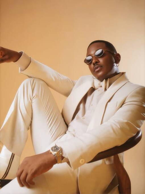 Timini in a monochromatic ivory suit look