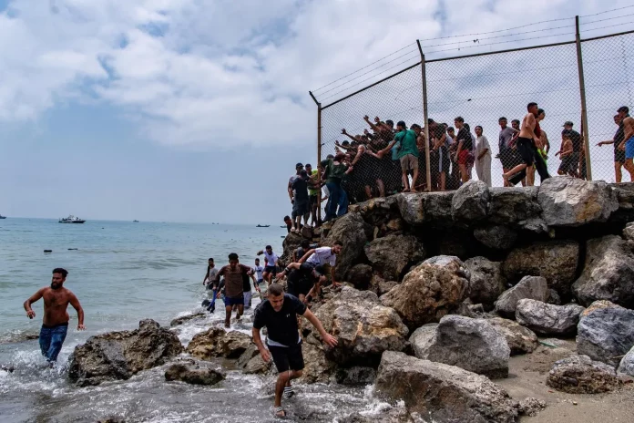 Spain tightens security after thousands of Moroccan migrants cross into Ceuta Spain tightens security after thousands of Moroccan migrants cross into Ceuta